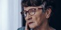 elderly woman pondering