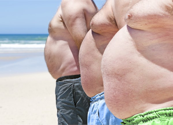 obese men on beach